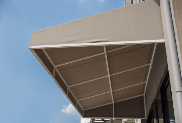 Brown,Awning,Over,Windows.,Canvas,Roof,Of,Shop.