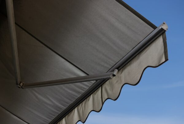 A,Large,Awning,With,A,Blue,Sky,In,The,Background.